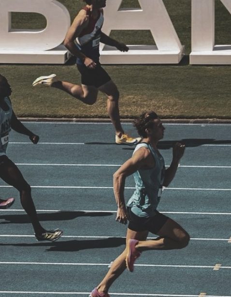 Dylan sprinting on a blue track